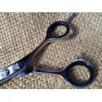 Barber Scissor with Micro Serrated edge.